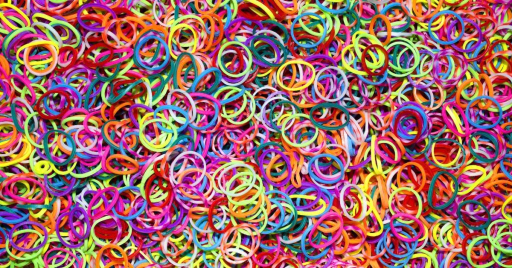 A large pile of multicolor rubber bands